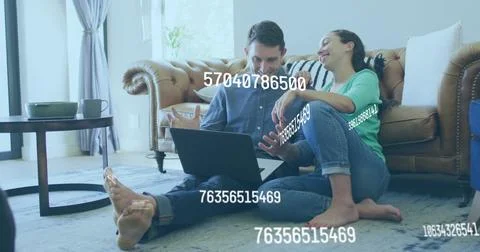 Image of data processing over caucasian couple using laptop Foto stock