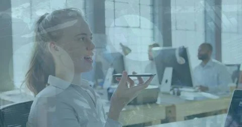 Image of data processing over caucasian businesswoman talking on smartphone in Stock Photos