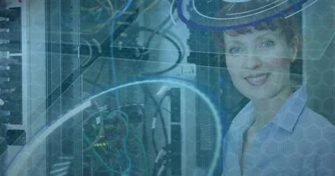 Image of data processing over caucasian woman smiling in server room Foto stock