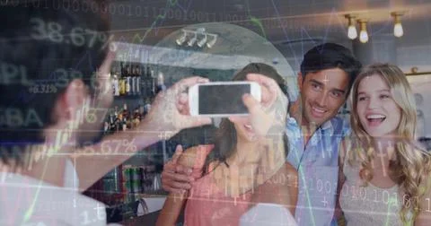 Image of data processing over caucasian male waiter taking picture of group of Foto stock