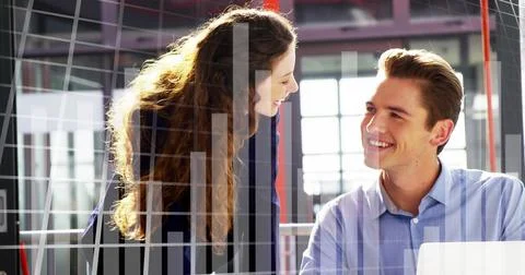 Image of data processing over caucasian man and woman smiling looking at laptop Stock Photos