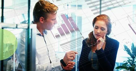 Image of data processing over caucasian man and woman discussing over laptop at 스톡 사진