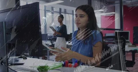 Image of data processing over caucasian woman with document looking at computer Stock Photos