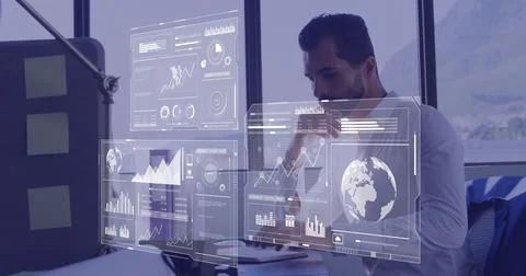 Image of data processing over caucasian businessman using computer in office Stockfoto's