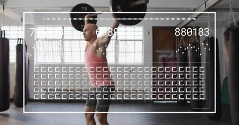 Image of data processing over caucasian man lifting barbell at gym 写真素材