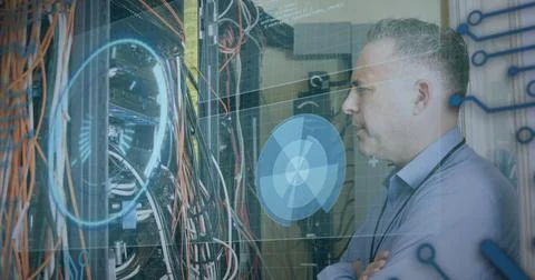 Image of data processing over caucasian man checking servers Stockfoto's