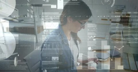 Image of data processing over caucasian businesswoman using tablet Stock Photos
