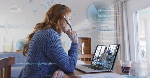 Image of data processing over caucasian woman working from home, having image Stock Photos