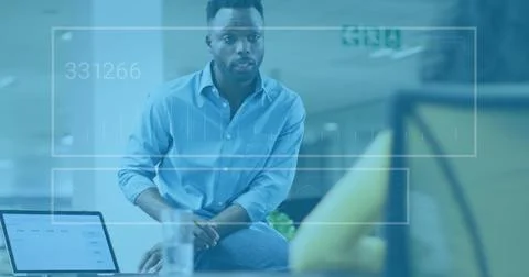 Image of data processing over diverse man and woman discussing over a lapto.. 스톡 사진
