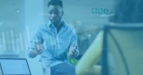Image of data processing over diverse man and woman discussing over a lapto.. 库存照片