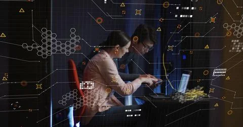 Image of data processing over diverse it technicians with laptop by computer Stock Photos