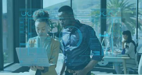 Image of data processing over diverse man and woman discussing over laptop at Foto stock