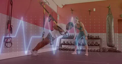 Image of data processing over diverse man and woman exercising in gym Foto stock