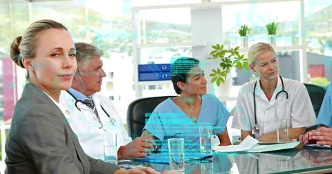 Image of data processing over diverse doctors at meeting Foto stock