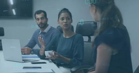 Image of data processing over diverse colleagues discussing work in office 스톡 사진