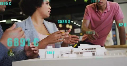 Image of data processing over diverse colleagues discussing work in office Stockfoto's