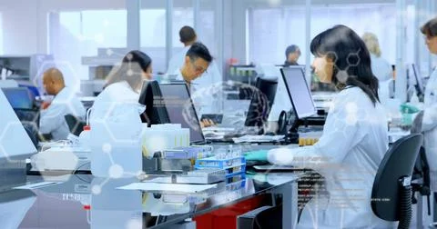 Image of data processing over diverse scientists working in lab 库存照片