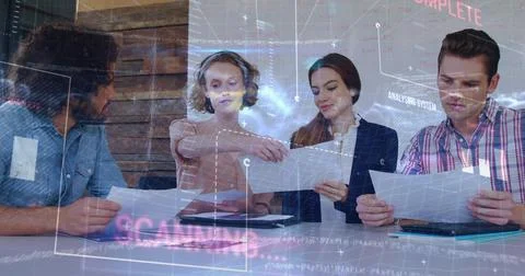 Image of data processing over diverse colleagues discussing over documents at Stock Photos