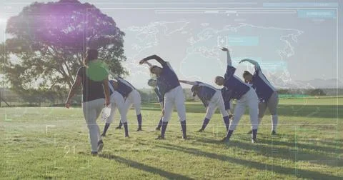 Image of data processing over diverse female baseball players exercising Foto stock