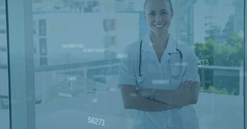 Image of data processing over happy cauasian female doctor with arms crossed Stock Photos