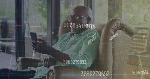 Image of data processing over happy african american man using smartphone Stock Photos