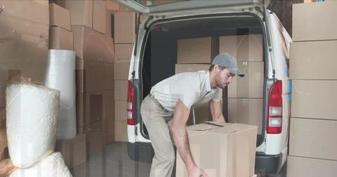 Image of data processing over man packing boxes into car Foto stock