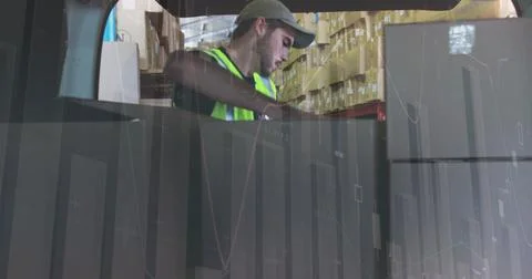 Image of data processing over man packing boxes into car 스톡 사진
