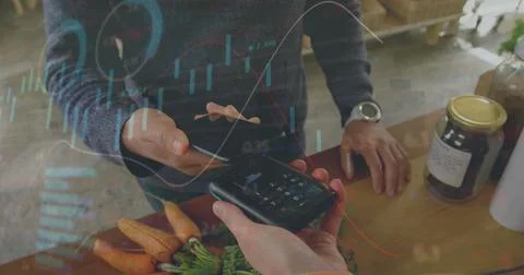 Image of data processing over mid section of man using smartphone to make Stock Photos