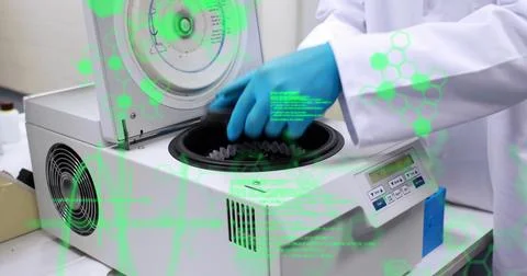 Image of data processing over mid section of a scientist using centrifuge 스톡 사진