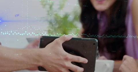 Image of data processing over people using tablet Stockfoto's