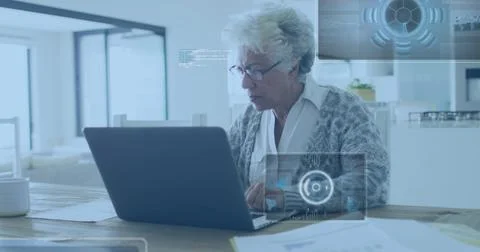 Image of data processing over senior african american businesswoman working on Foto stock