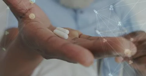 Image of data processing over senior african american man with pills Stock Photos