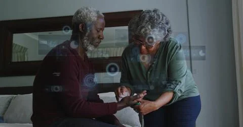 Image of data processing over senior african american couple cleaning hand Stock Photos