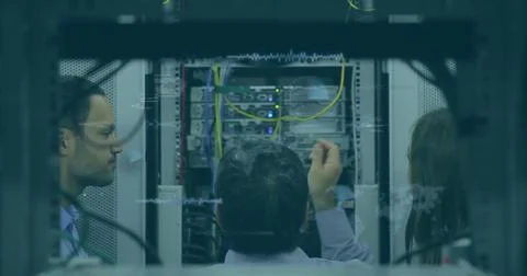 Image of data processing over team of diverse engineers working at computer 스톡 사진