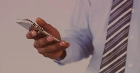 Image of data processing on screen over man using smartphone 스톡 사진