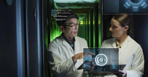 Image of data processing on screens over diverse man and woman working in server Stock Photos