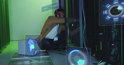 Image of data processing on screens over african american man working in server Stock Photos