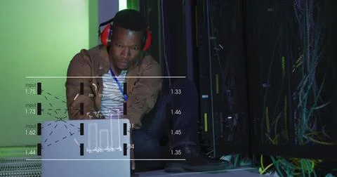 Image of data processing on screens over african american man working in server Stock Photos