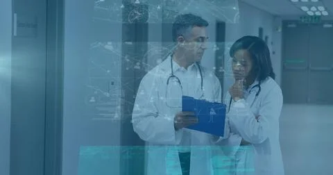 Image of data processing on screens over diverse female and male doctors talking 写真素材