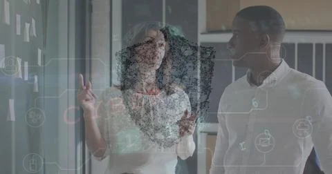 Image of data processing with shield icon over diverse business people in office Foto stock