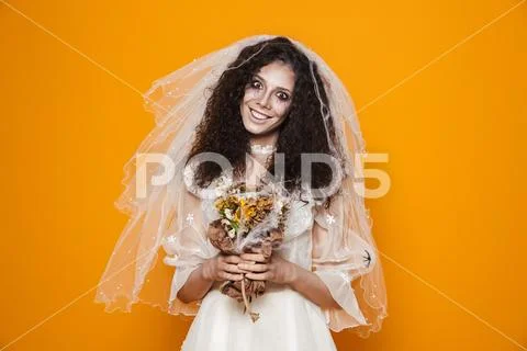 Image of dead bride zombie on halloween wearing wedding dress and scary makeu Stock Photos