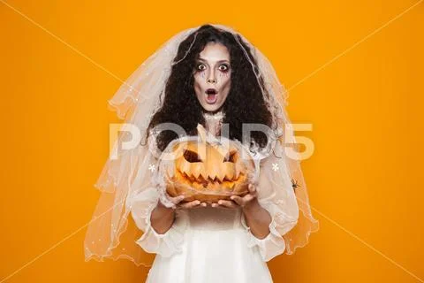 Image of dead bride zombie on halloween wearing wedding dress and scary makeu Stock Photos