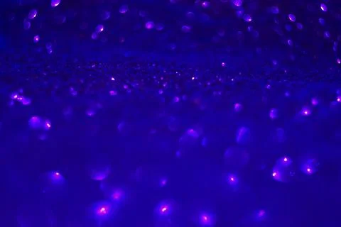 Image off deep ultraviolet light on red glitter Stock Photos