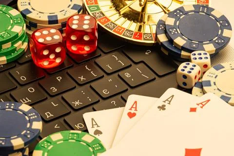 Image depicts casino elements, including poker chips, playing cards, and a .. Stock Photos