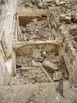Image depicts a devastating scene post-explosioncollapse, showing a large h.. Stock Photos