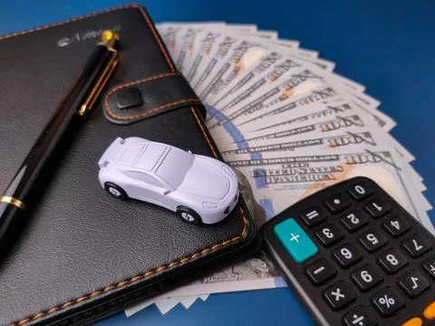 The image depicts items commonly associated with managing car ownership fin.. Stock Photos