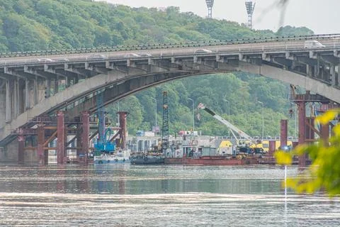 Image depicts a partially constructed metro bridge over the Dnepr River in .. Stock Photos