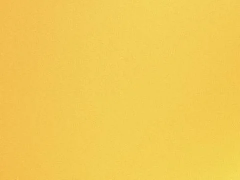 The image depicts a smooth yet subtly textured golden-yellow fabric surface.. Ilustración de archivo