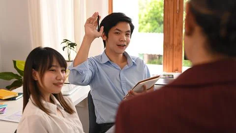 Image of developer team collaborating on mobile application software design Stock Photos