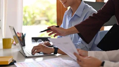 Image of developer team collaborating on mobile application software design Stock Photos